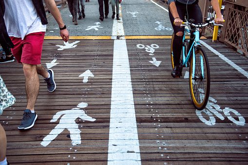 Pedestrian and bicycle riders sharing the street lanes